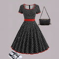 Multicolour polka dot pleated dress with square collar and front zipper.