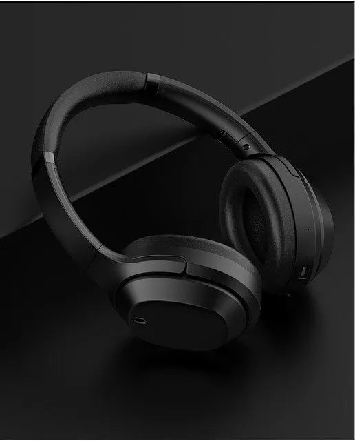 Black over-ear Bluetooth headphones with memory-protein ear cushions and stainless steel headband adjustment