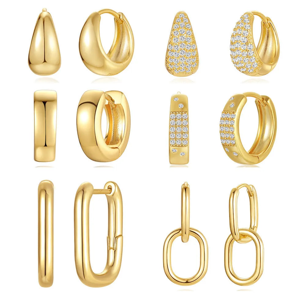 Golden brass earclip earrings with geometric shapes and round elements