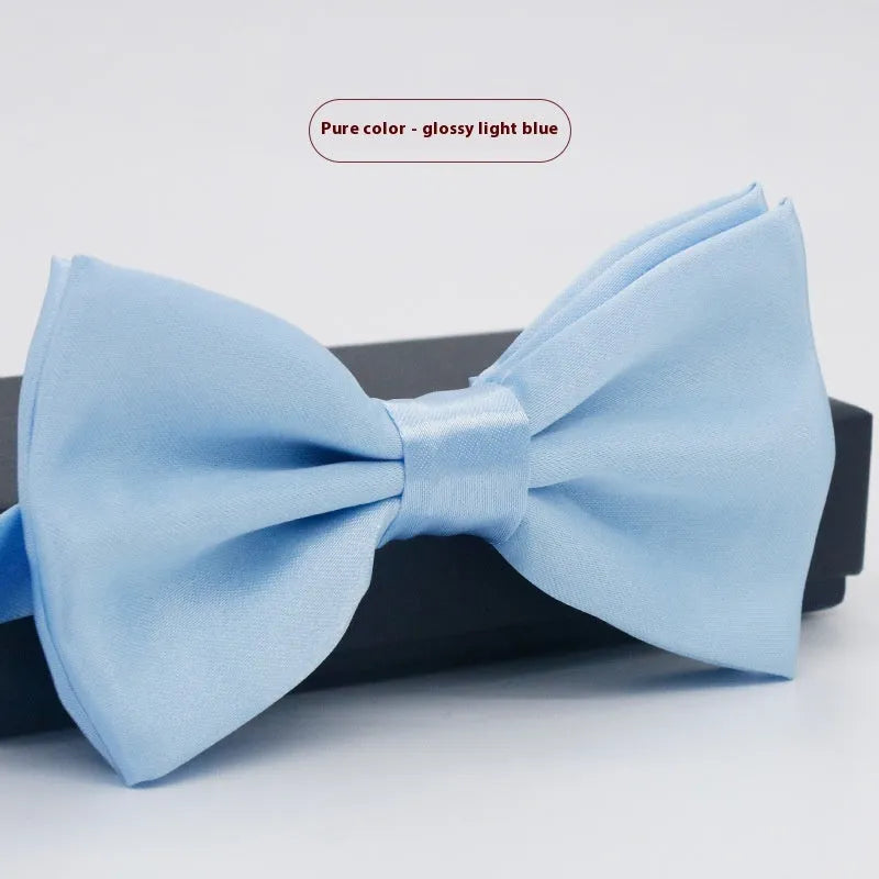 Solid colour flat head bow tie for formal wear in multiple colours including black, red, and blue.