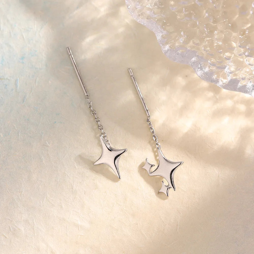 Asymmetric four eight-pointed stars hanging earrings in copper for women