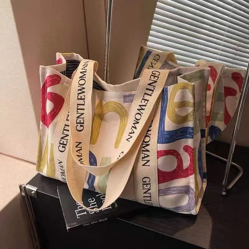 Large capacity cotton canvas tote bag with printed design options including black letter, coloured letter and pattern styles