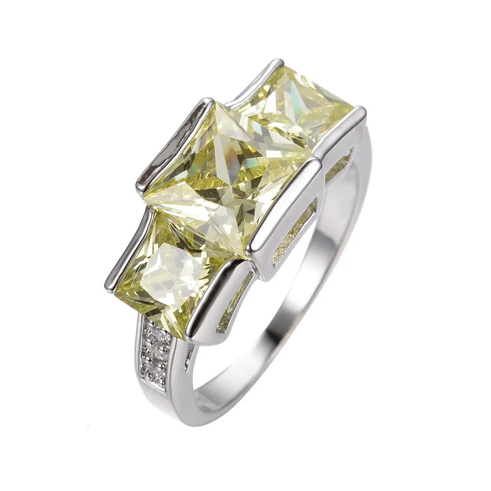 Geometric copper women's ring in champagne colour on a size no.8 finger, showing metal band and electroplated finish.