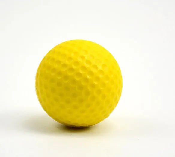 10 yellow PU foam indoor practice golf balls with 41mm diameter on a green surface