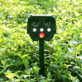 Green solar-powered ultrasonic dog repeller unit for outdoor garden protection