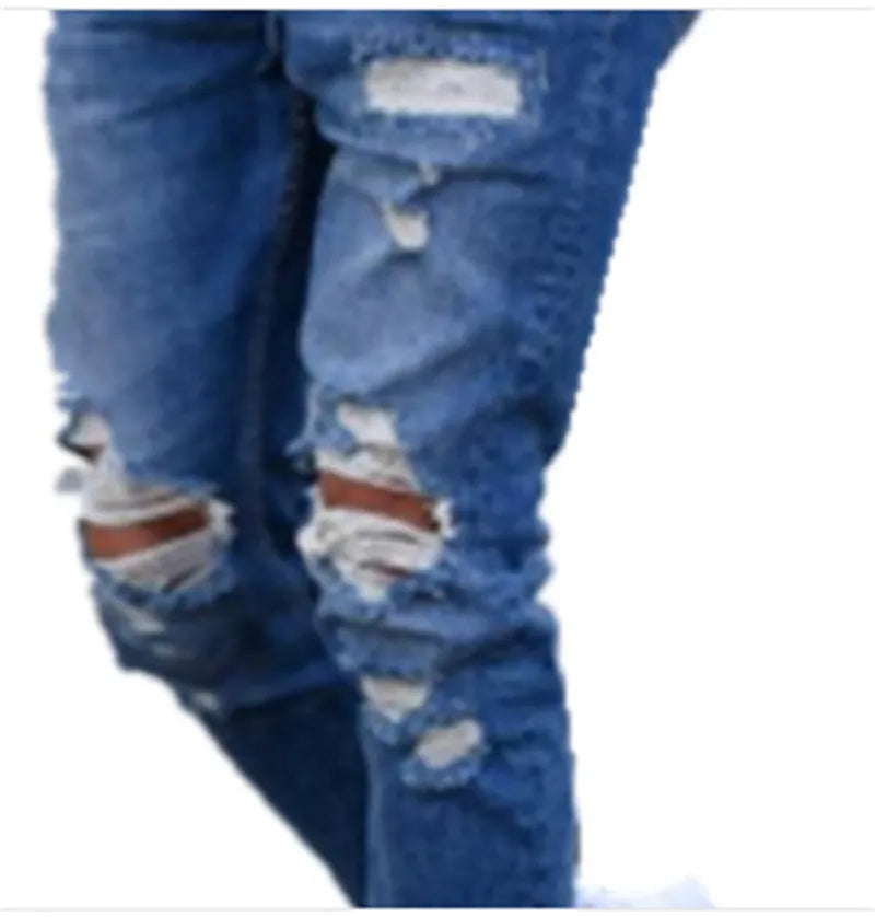 Men's blue jeans with hole detailing showing cotton fabric texture and distressed design