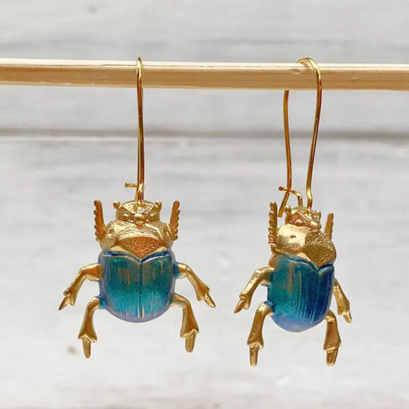 Retro beetle earrings for women, gold metal with electroplated blue finish, creative insect design