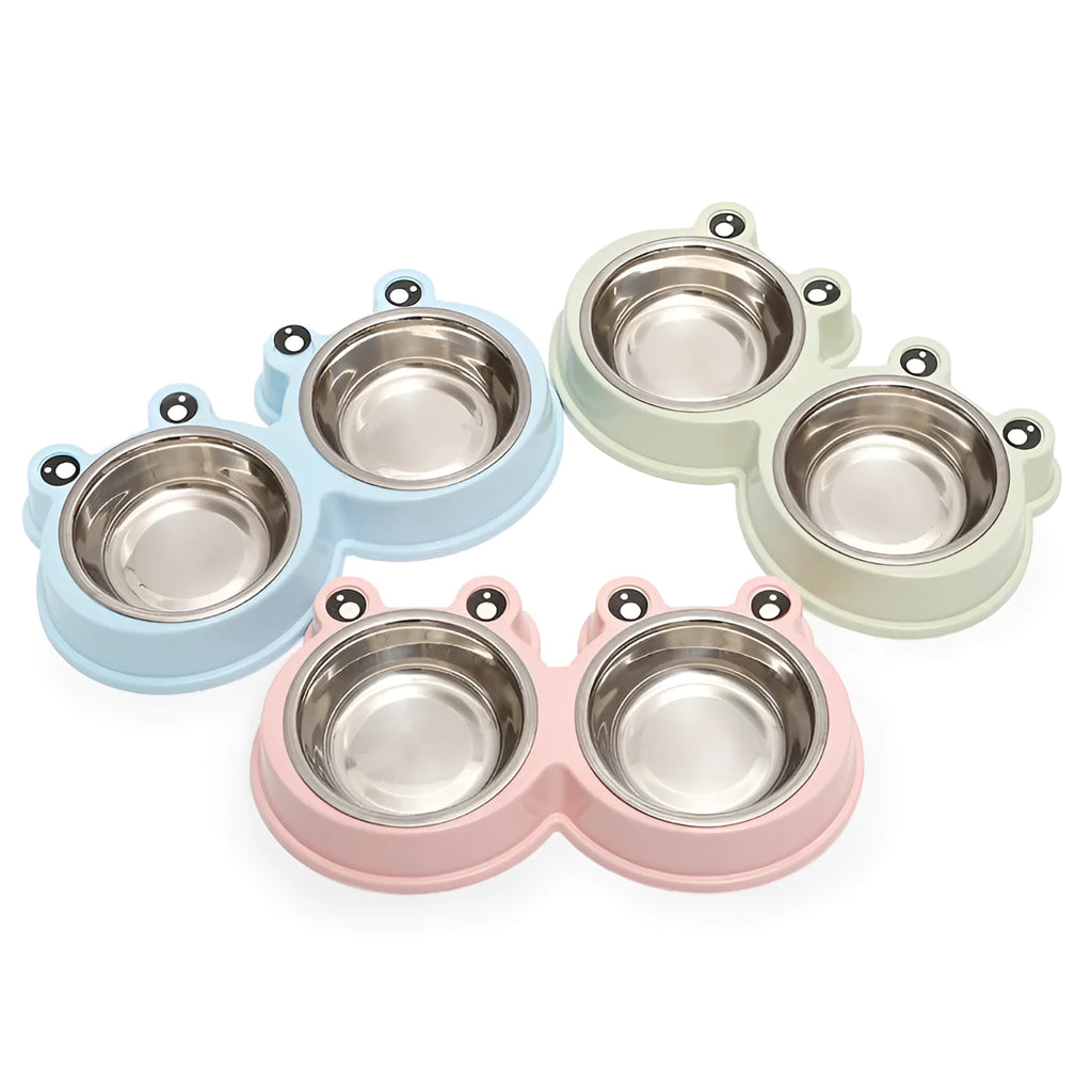Frog-shaped plastic holder containing two stainless steel pet bowls for food and water.