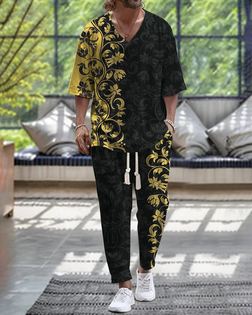 Thin polyester fibre co-ordinated suit with V-neck top, cropped sleeves, and matching trousers on a hanger.