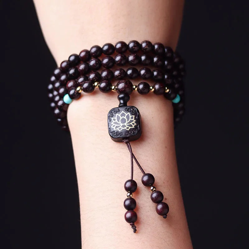 Zambian rosewood Buddha beads bracelet with flat lotus pendant showing 108 wooden beads