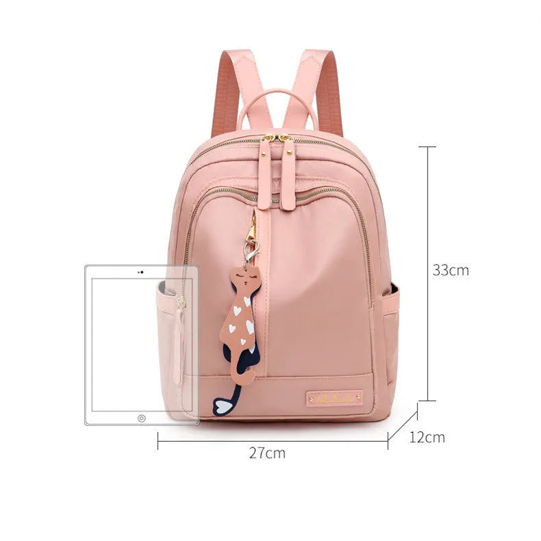 Women's casual backpack in black or pink with 20L capacity, waterproof nylon construction, and internal organiser compartments