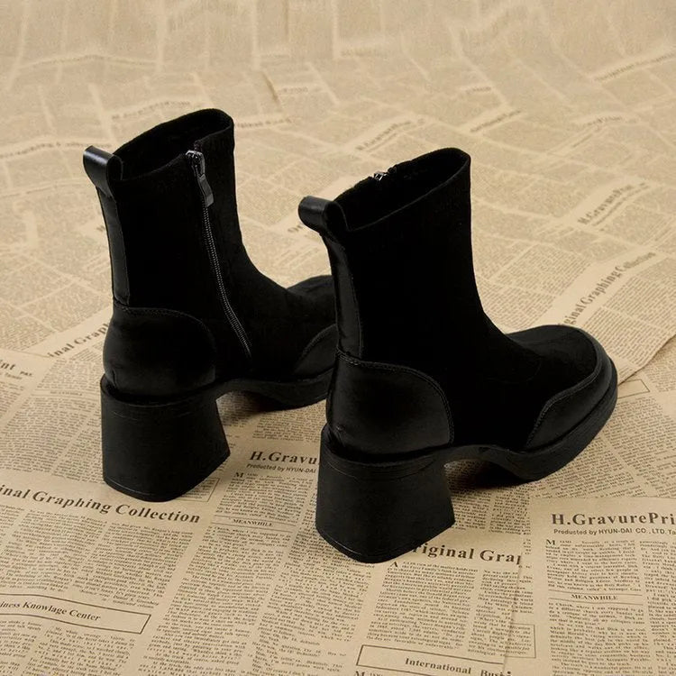 Black women's chunky heel martin boots with thick rubber sole and lace-up design