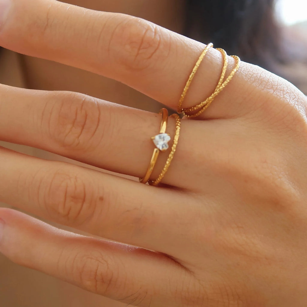 Golden stainless steel women's ring with love heart or oval centrepiece in sizes no.5 to no.8