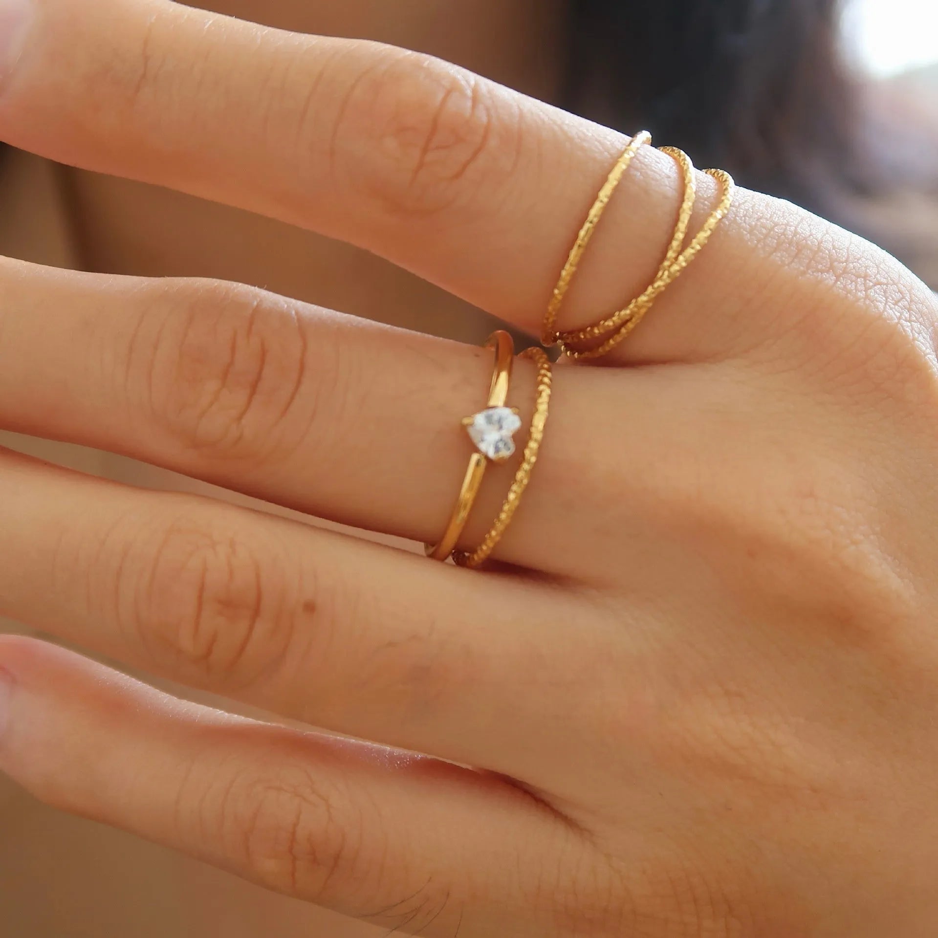 Golden stainless steel women's ring with love heart or oval centrepiece in sizes no.5 to no.8