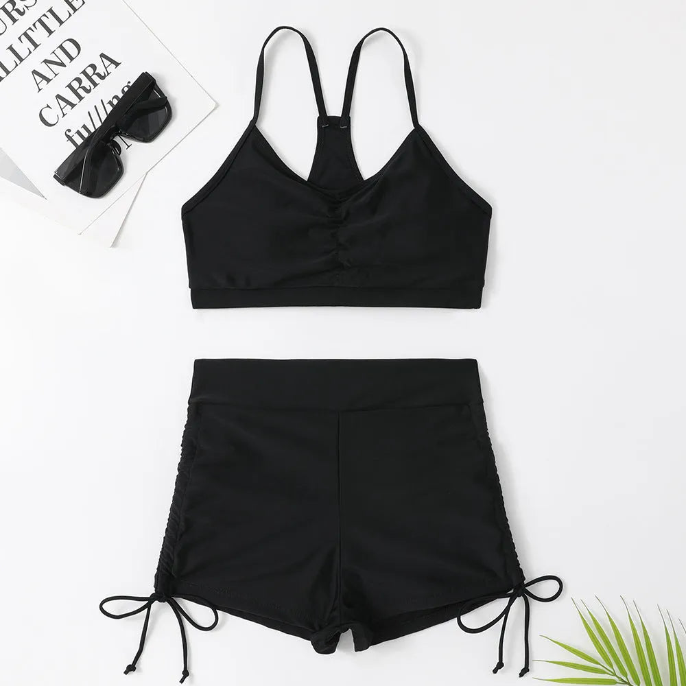 Purple and black women's high waist bikini swimsuit set on a mannequin.