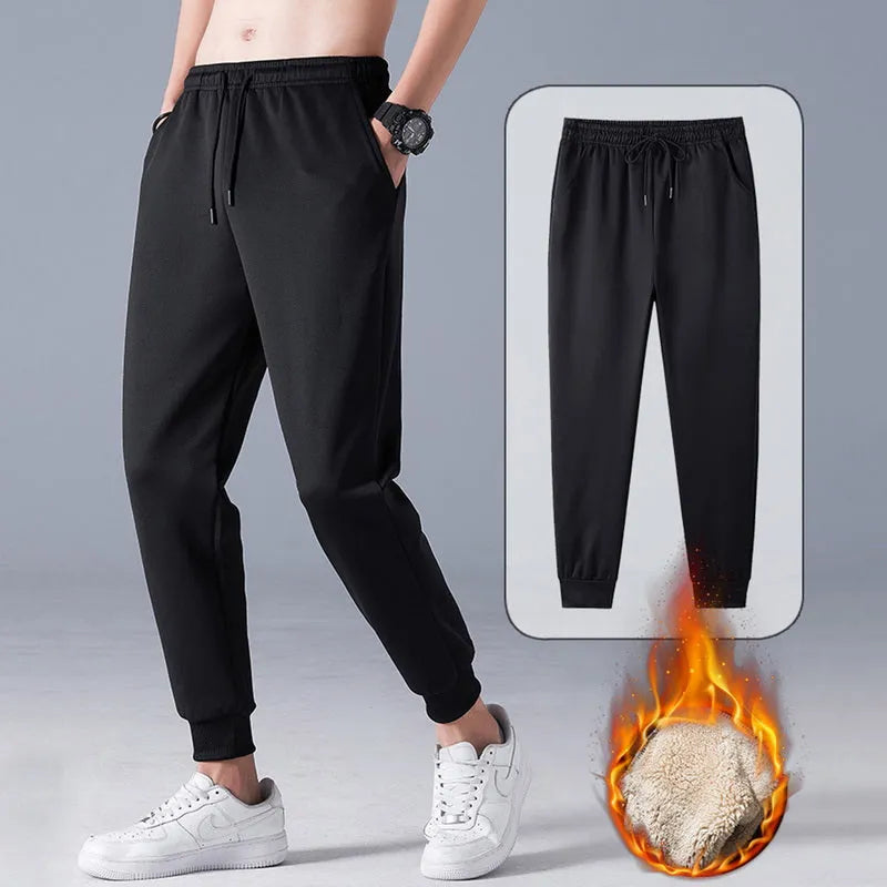 Black fleece lined straight tube trousers with drawstring elastic waist, zippered fly, and belt, sizes M to 5XL