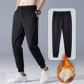 Black fleece lined straight tube trousers with drawstring elastic waist, zippered fly, and belt, sizes M to 5XL