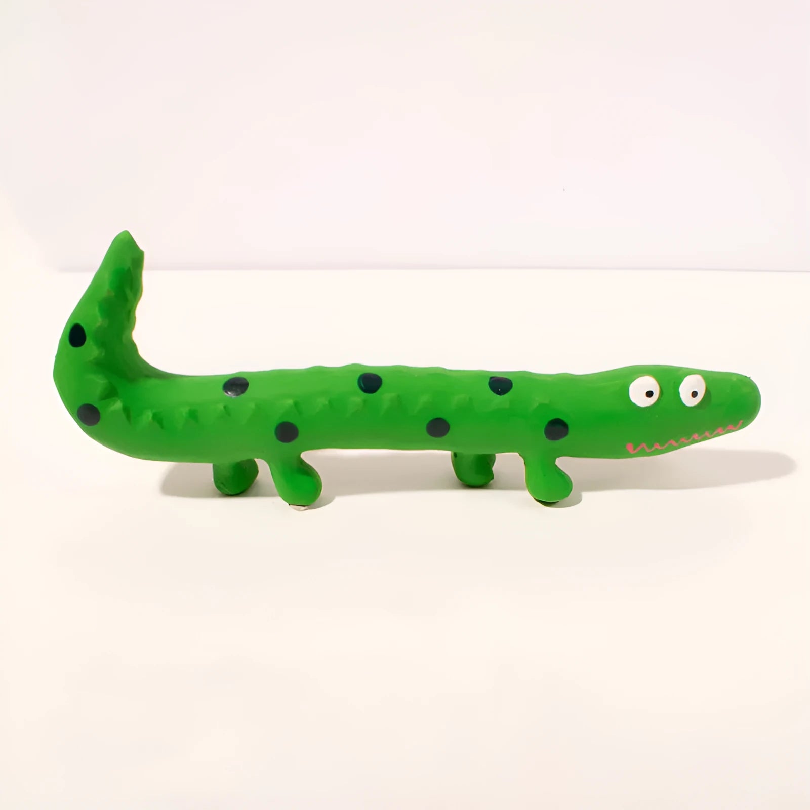 Green lizard-shaped dog chew toy with squeaker for aggressive chewers, shown with dimensions.