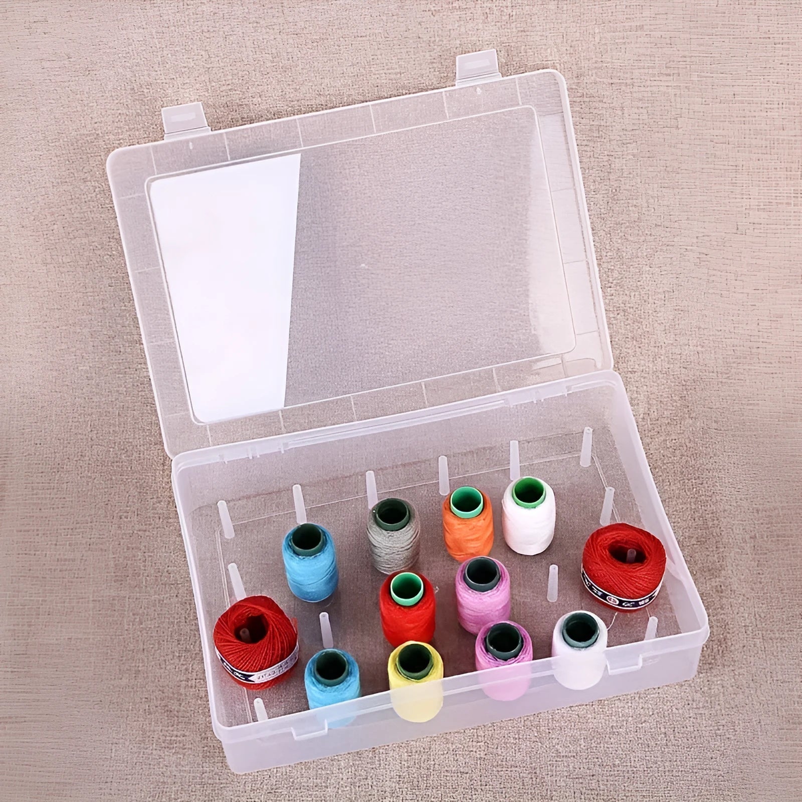 Clear plastic storage box with 42 compartments for embroidery threads and needlework supplies