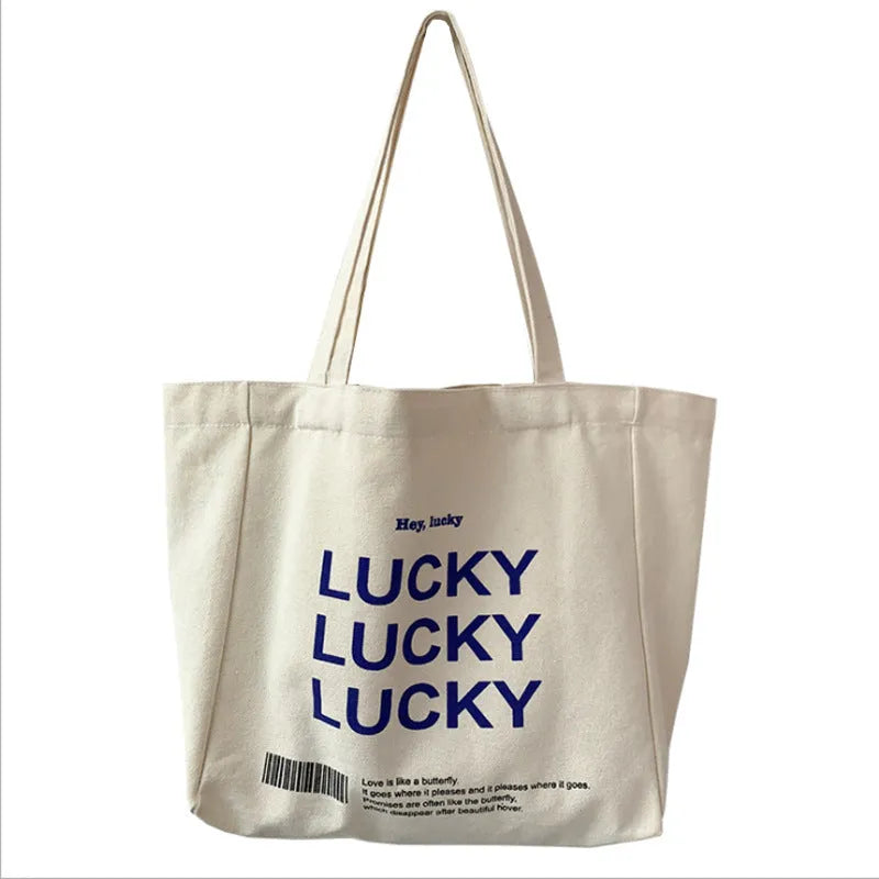Natural colour canvas tote bag with metal magnet buckle closure and small front pocket, 32x31.5x10cm