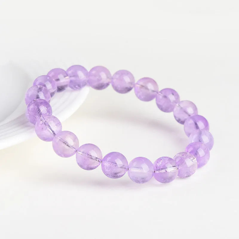 Lavender amethyst round bead bracelet with water ripple geometric pattern showing light purple crystal beads
