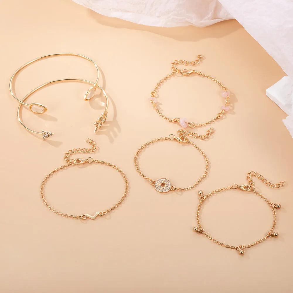 Golden spot drill arrow and water drop shaped bracelet set with six zinc alloy pieces