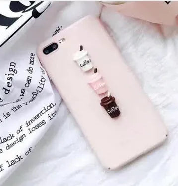 Soft silicone iPhone case with a raised 3D cartoon cat design in pink.