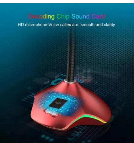 Black wired condenser microphone with built-in stand and pop filter sponge on a desk.