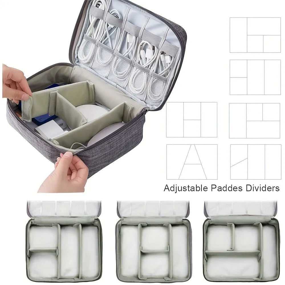 Black waterproof travel cable organiser bag open, showing mesh pockets, elastic loops, and removable padded dividers.
