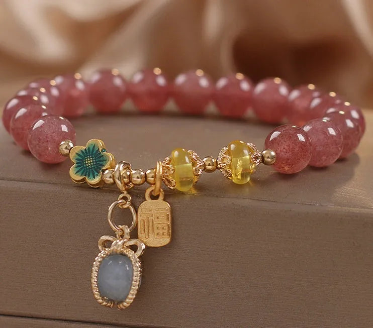 Red strawberry quartz beaded bracelet with alloy components and rhinestone accents for women