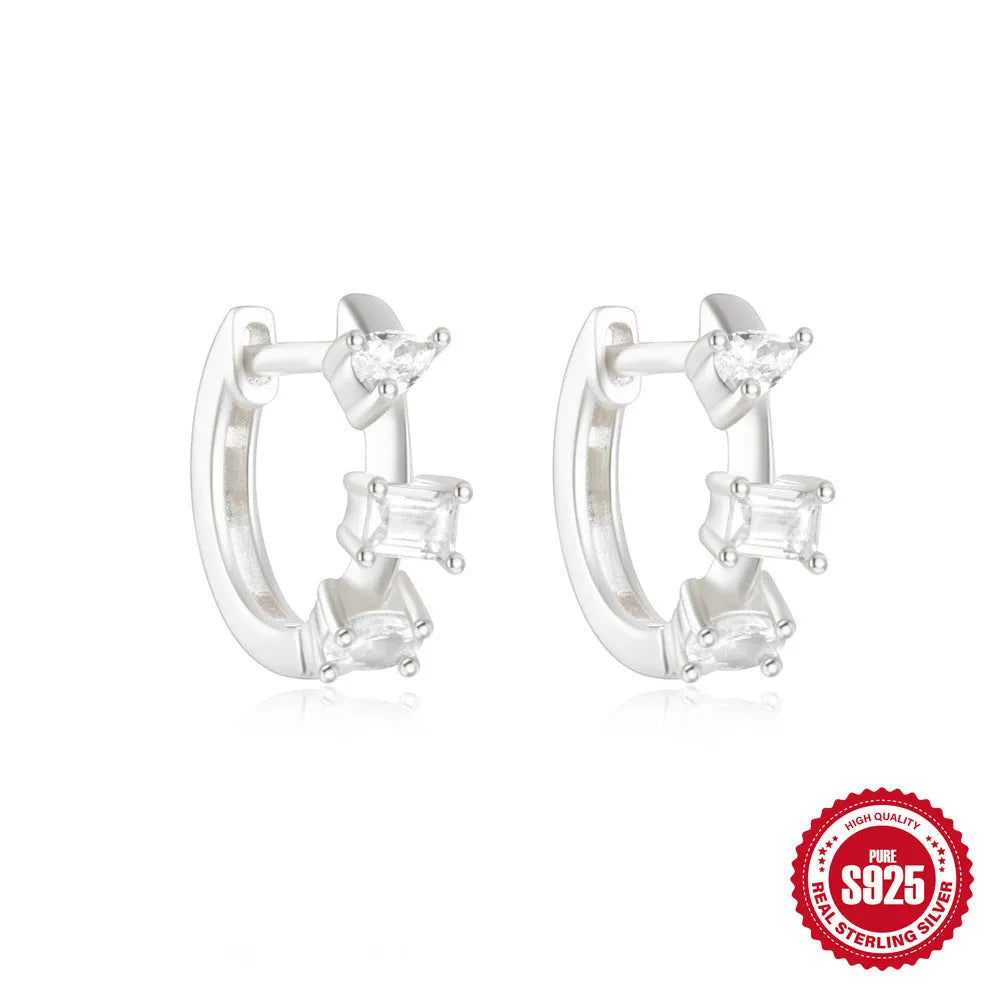 Sterling silver geometric stud earrings with round diamond accents in gold and silver electroplated finishes