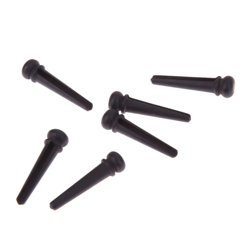 Six matte black ebony guitar bridge pins with a 5.3mm bayonet for folk acoustics.
