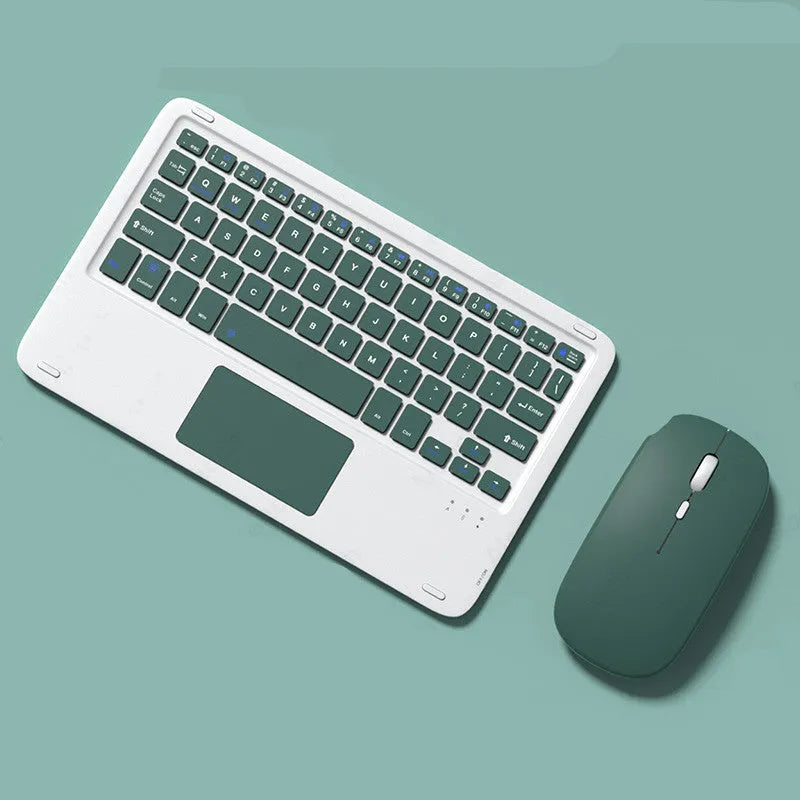 Pink Bluetooth touch keyboard and rechargeable wireless mouse on a desk next to a tablet.