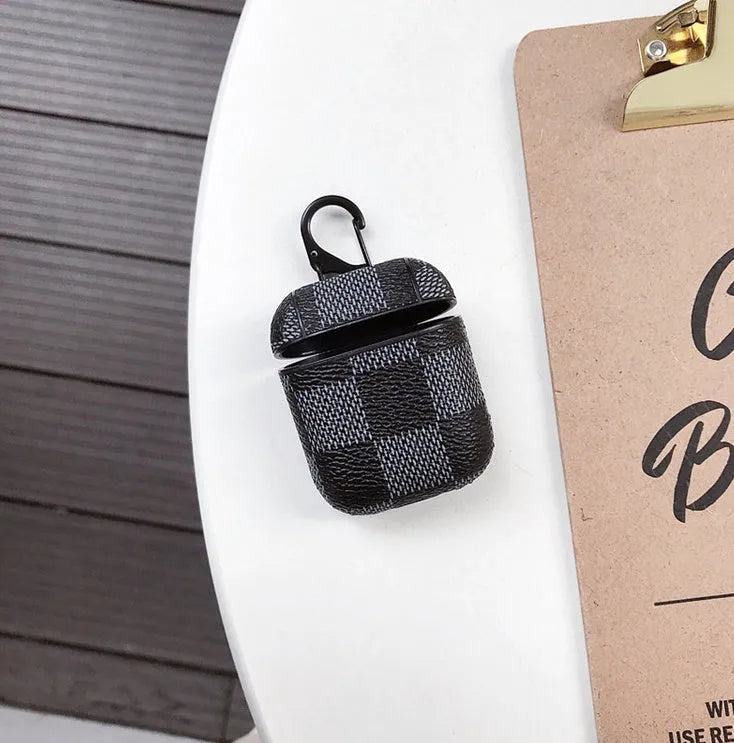 iPhone XS Max hard shell plastic case with grid pattern and integrated hook for Apple AirPods 2nd gen case.