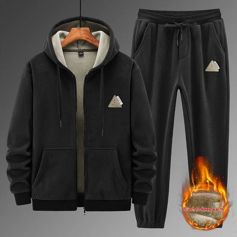 Grey hooded sweater and matching trousers casual sports suit on a hanger.