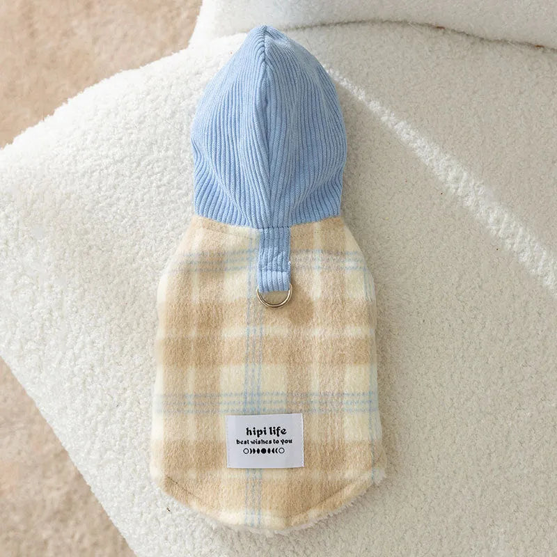 Blue corduroy dog hooded vest with a chessboard grid pattern and traction detailing.