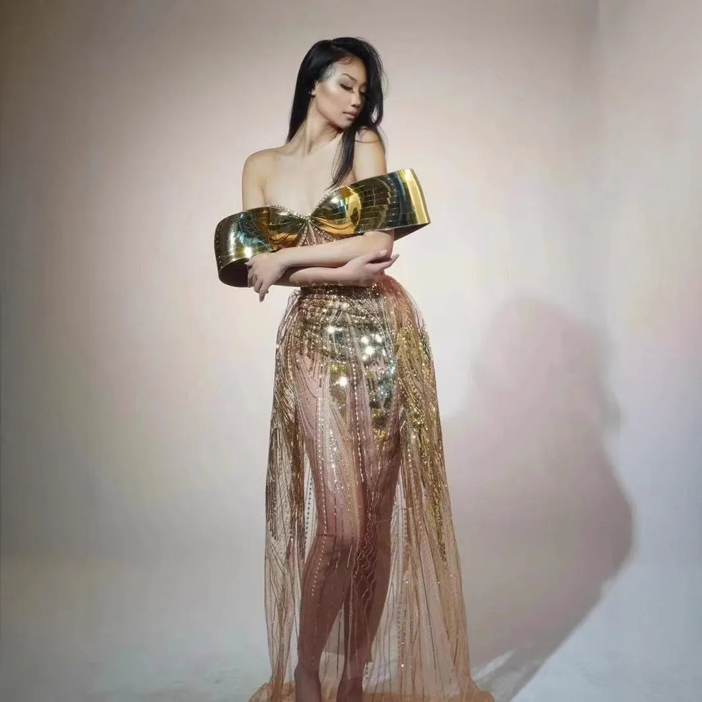 Gold sequined strapless long dress with a tulle skirt and high side slit.