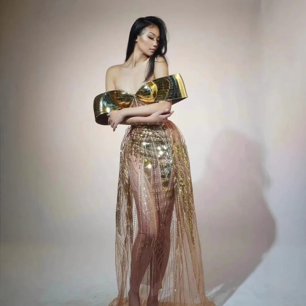 Gold sequined strapless long dress with a tulle skirt and high side slit.