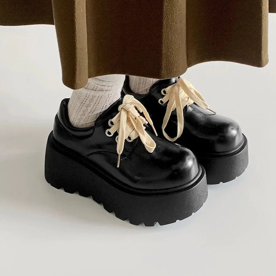 Matte black women's retro lace-up shoes with a chunky block heel and round toe.