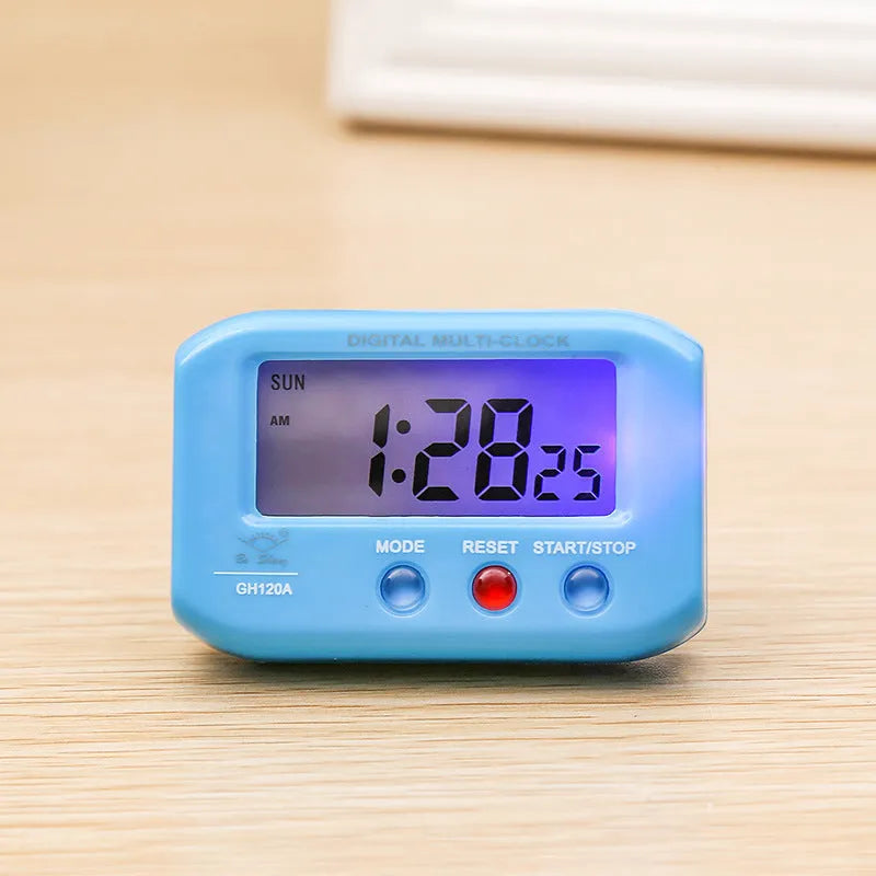 Portable LCD alarm clock with luminous display, showing time and date on screen