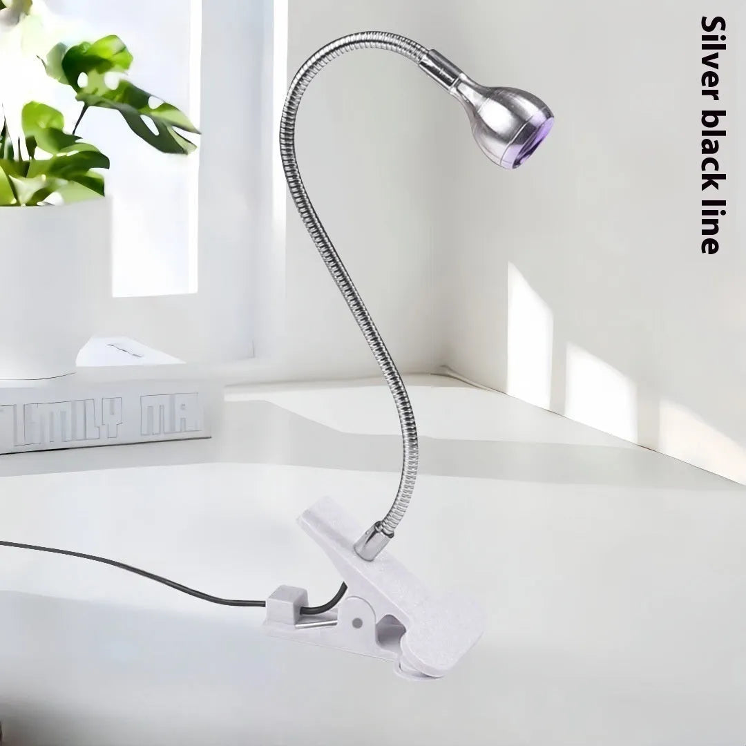 Goose neck nail lamp with USB clip, 395nm purple light curing UV glue on nails in a home manicure setting.