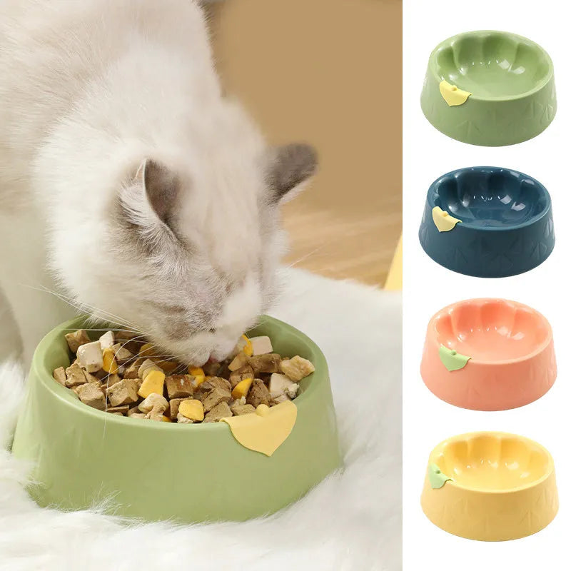 Green plastic double pet bowl feeder for dogs and cats on a white background