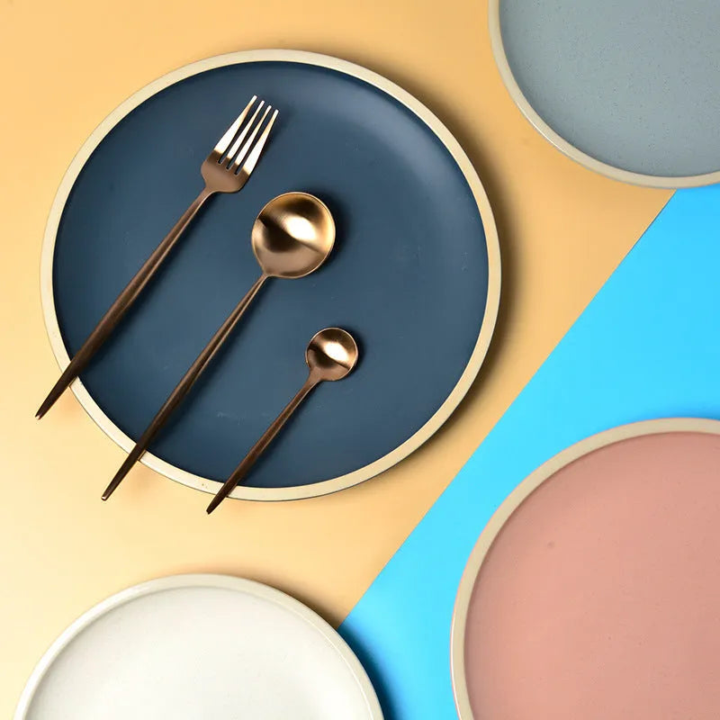 Blue matte ceramic dinner plate 10 inches with sesame point glaze on a table