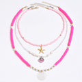 Polymer clay beaded necklace with multi-layer twin clavicle chain and geometric alloy pendant on female model