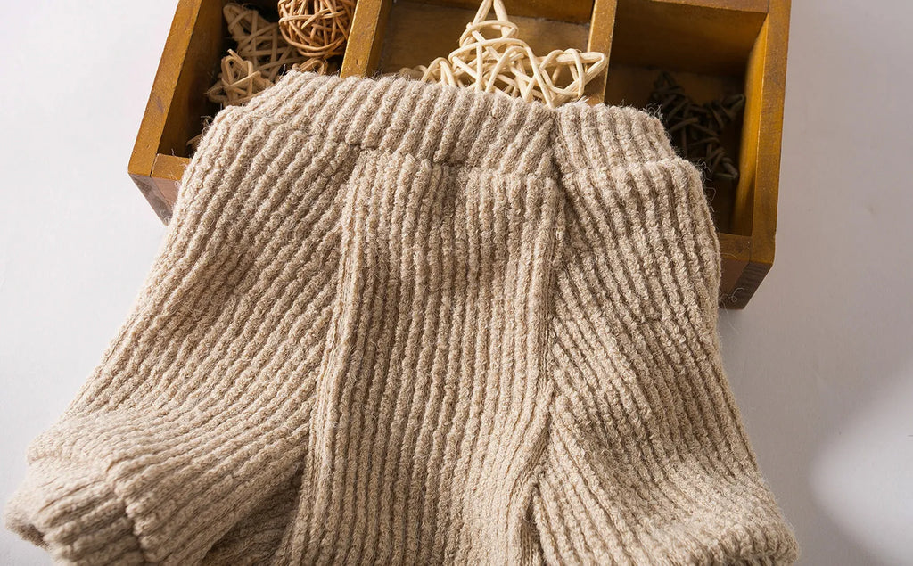 Brown cloth dog sweater pullover on a small dog, showing casual fit.