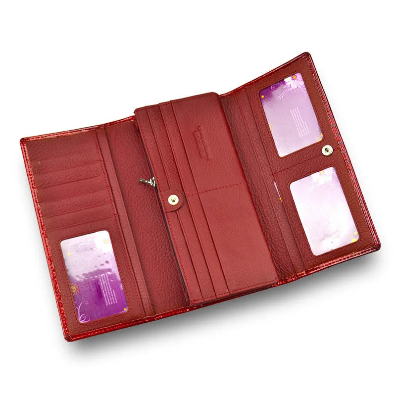 Women's red patent leather coin purse with embossed crocodile pattern texture.