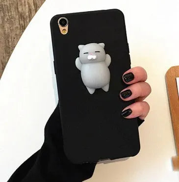 Soft silicone iPhone case with a raised 3D cartoon cat design in pink.