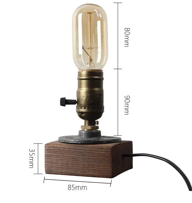 Compact water pipe design table lamp made from wood and iron on a wooden surface.