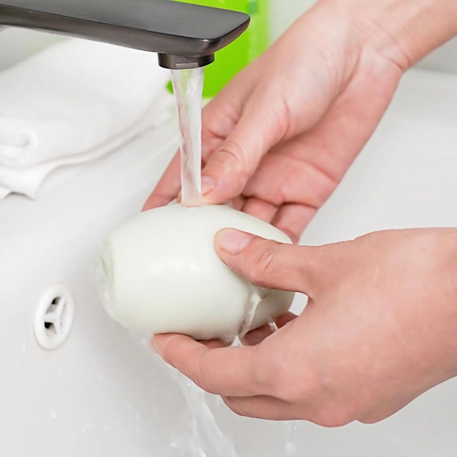 Washable reusable gel lint roller ball in green and white colours for pet hair removal