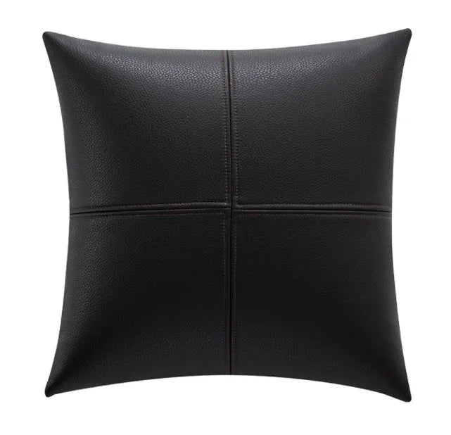 Simple solid colour cowhide leather pillow cover on a sofa, shown in a beige white colour.